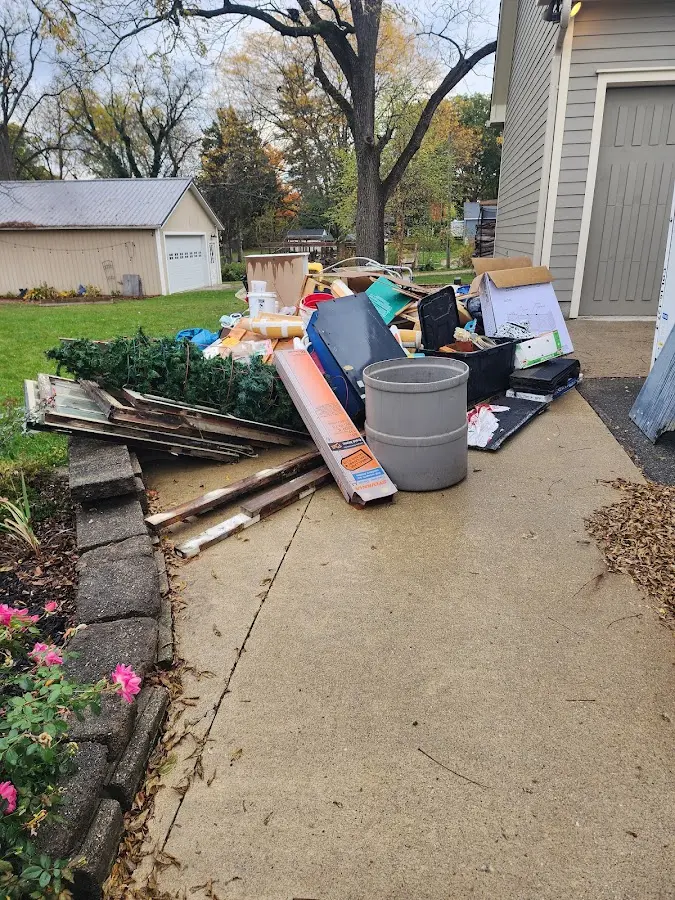 Dumpster being loaded with debris for Commercial Dumpster Rental in Meadow Lakes